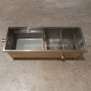 Stainless steel grease trap 1000×400×400 mm on grey cement floor in Uganda